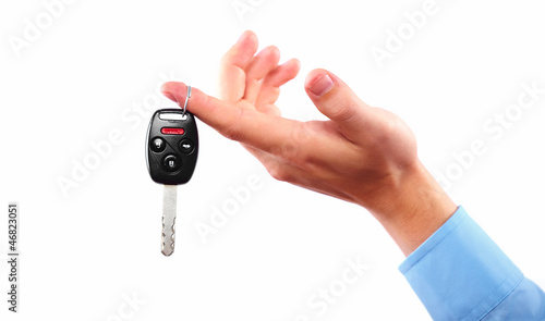 Photo: Hand with a car key. Hand with a car key.