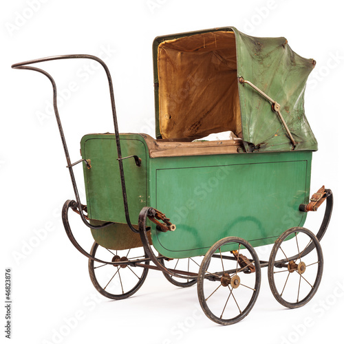 Photo: 19th Century baby pram isolated on white 19th Century baby pram isolated on white