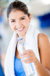 Gym woman with a bottle of water