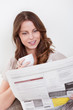 Woman reading the newspaper
