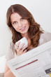 Woman reading the newspaper