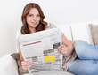Woman reading the newspaper