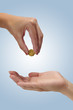 Woman holding coin Ducat