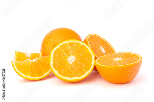 Photo: Sliced orange fruit segments isolated on white background Sliced orange fruit segments isolated on white background