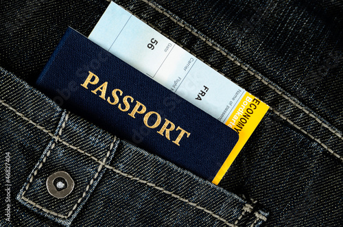 Photo: pasport with boarding pass in jeans pasport with boarding pass in jeans