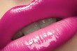 Photo: Close-up of lips with bright fashion pink glossy makeup Close-up of lips with bright fashion pink glossy makeup