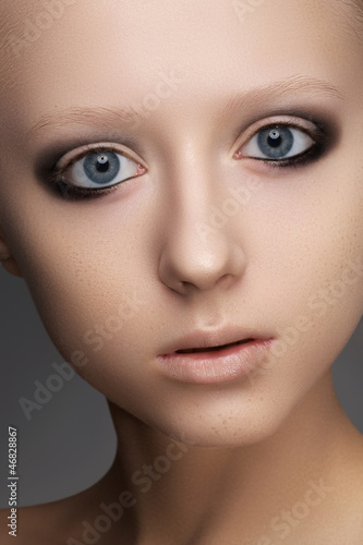 Photo: Dark brown smoky eyes makeup and beige lips make-up Dark brown smoky eyes makeup and beige lips make-up