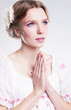 Photo: Devotion. Faith. Young christian woman praying against her sin Devotion. Faith. Young christian woman praying against her sin