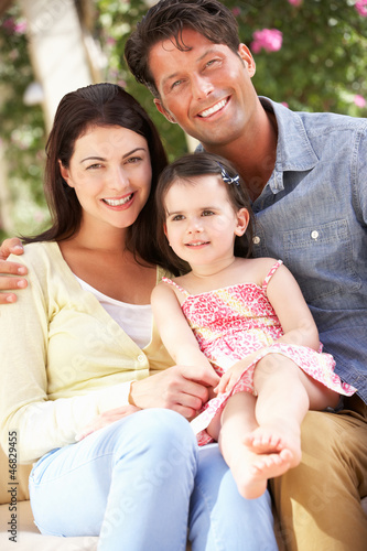 Photo: Family Sitting On Sofa Together Family Sitting On Sofa Together