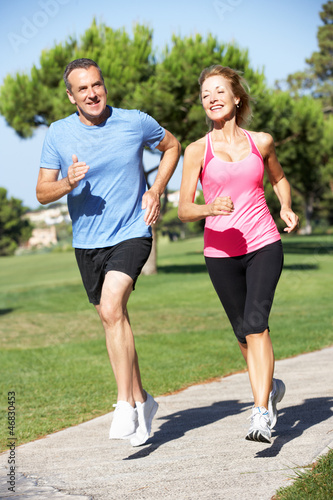Photo: Senior Couple Exercising In Park Senior Couple Exercising In Park
