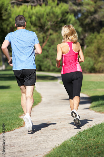 Photo: Senior Couple Exercising In Park Senior Couple Exercising In Park