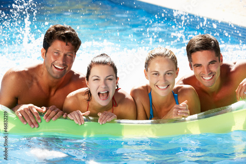 Photo: Group Of Friends Having Fun In Swimming Pool Group Of Friends Having Fun In Swimming Pool