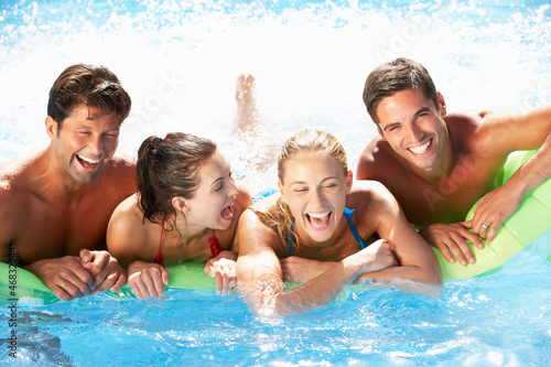 Photo: Group Of Friends Having Fun In Swimming Pool Group Of Friends Having Fun In Swimming Pool