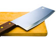 Shiny meat cleaver with cutting board