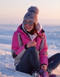 Young woman relaxing on snow