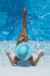 Photo: Woman relaxing in a swimming pool Woman relaxing in a swimming pool