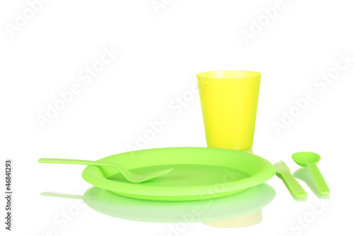 Photo: bright plastic disposable tableware isolated on white bright plastic disposable tableware isolated on white