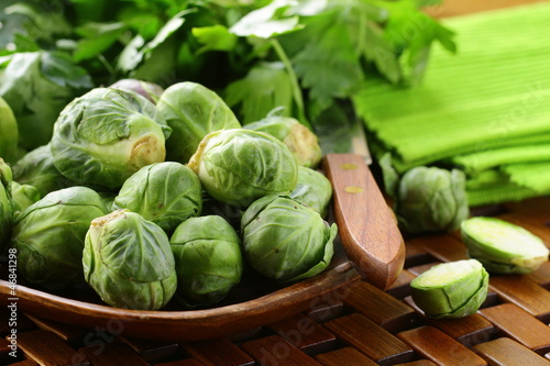 Photo: fresh raw brussels sprouts on a wooden table fresh raw brussels sprouts on a wooden table