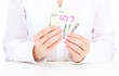 American dollars in a women hands, close up