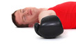 Defeated boxer lying on the ground