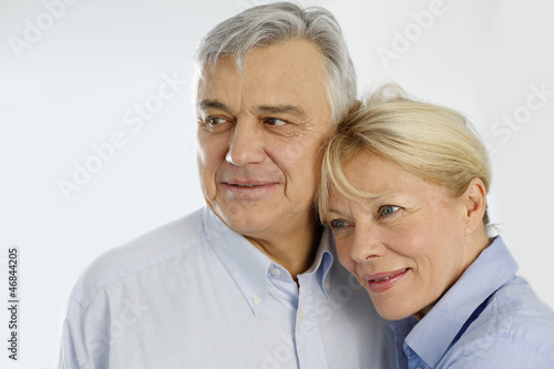 Photo: Portrait of cheerful senior couple at home Portrait of cheerful senior couple at home