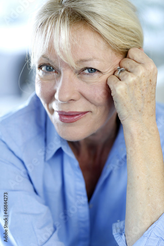 Photo: Closeup of senior woman with blue shirt Closeup of senior woman with blue shirt