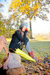 Beautiful young woman with umbrella in park