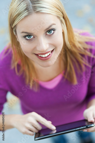 Photo: Young woman using digital tablet Young woman using digital tablet