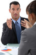 businessman and businesswoman having a discussion