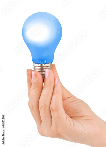 Photo: Hand with blue lamp Hand with blue lamp