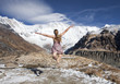 Photo: blond girl fly toward snow mountains blond girl fly toward snow mountains