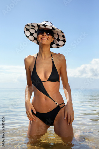 Photo: Woman in a trendy swimsuit Woman in a trendy swimsuit