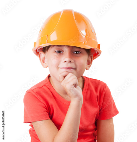 Photo: Girl in a protective helmet sits Girl in a protective helmet sits