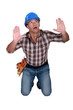 Tradesman surrounded by an invisible wall