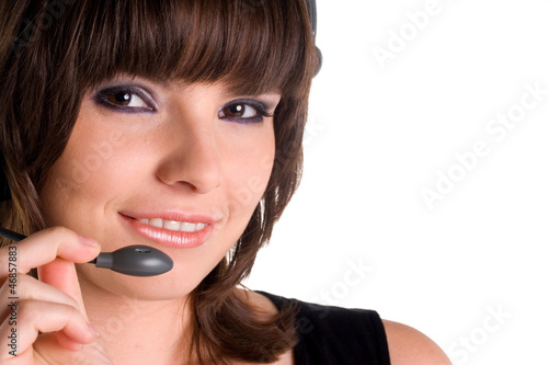 Photo: Portrait female customer representative with headset Portrait female customer representative with headset