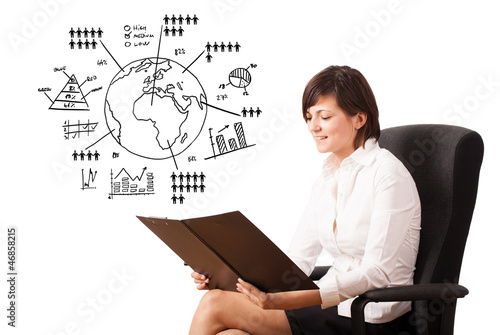 Photo: Young woman presenting globe with diagrams isolated on white Young woman presenting globe with diagrams isolated on white