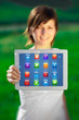 Young woman looking at modern tablet with abstract lights and va