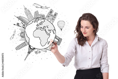 Photo: Young woman drawing a globe on whiteboard Young woman drawing a globe on whiteboard