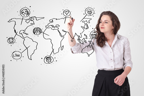 Photo: Young woman drawing a social map on whiteboard Young woman drawing a social map on whiteboard