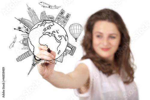 Photo: Young woman drawing a globe on whiteboard Young woman drawing a globe on whiteboard