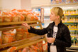 A woman buys bread