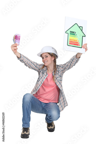 Photo: A female construction worker promoting energy savings. A female construction worker promoting energy savings.