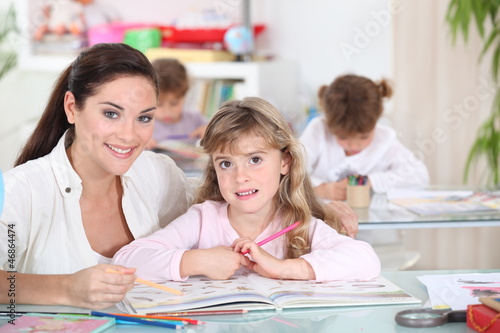 Photo: Three little girls in class Three little girls in class