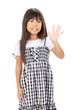 Smiling little asian girl showing her hand up