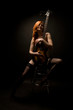 Beautiful rocked woman with guitar
