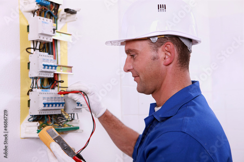 Photo: electrician measuring voltage electrician measuring voltage