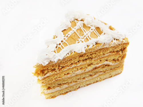 Photo: Triangular cake with cream ornament Triangular cake with cream ornament