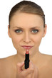 Woman applying lipstick