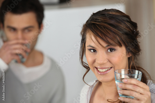 Photo: Couple drinking glass of water Couple drinking glass of water