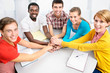 Students showing unity with their hands together